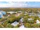 Beautiful aerial view of a coastal community surrounded by lush trees and featuring stunning marsh views at 94 Seaside Cottage Ln, Isle of Palms, SC 29451