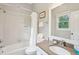 Functional bathroom featuring a bathtub, shower, and a granite-topped sink and vanity at 94 Seaside Cottage Ln, Isle of Palms, SC 29451
