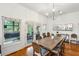 Elegant dining room featuring a large wooden table and French doors to a spacious deck at 94 Seaside Cottage Ln, Isle of Palms, SC 29451