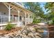 View of a charming home featuring a wrap-around porch and well-maintained landscaping at 94 Seaside Cottage Ln, Isle of Palms, SC 29451