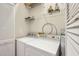 Laundry area with side-by-side washing machine and dryer with storage shelves at 94 Seaside Cottage Ln, Isle of Palms, SC 29451