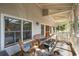 Relaxing screened porch offering comfortable wicker seating and views of the surrounding landscape at 94 Seaside Cottage Ln, Isle of Palms, SC 29451