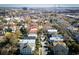 Beautiful aerial view of a neighborhood with colorful houses, palm trees, and a bridge in the background at 318 Sumter St, Charleston, SC 29403