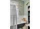 Relaxing bathroom with a clawfoot tub, stylish fixtures, and ample lighting at 318 Sumter St, Charleston, SC 29403