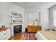 Bedroom featuring a decorative fireplace, dresser, and a large patterned rug at 318 Sumter St, Charleston, SC 29403