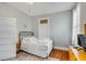 Simple bedroom with a bed, a nightstand, and hardwood floors with an area rug at 318 Sumter St, Charleston, SC 29403