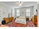 Comfortable bedroom with dresser, ceiling fan, and large windows at 318 Sumter St, Charleston, SC 29403