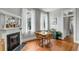 Dining room with hardwood floors, a fireplace, and a wooden table set for four at 318 Sumter St, Charleston, SC 29403