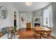 Spacious dining room with fireplace, hardwood floors, and access to multiple rooms at 318 Sumter St, Charleston, SC 29403