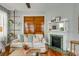 Cozy living room with decorative fireplace, wooden floors, and natural light at 318 Sumter St, Charleston, SC 29403