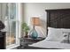 Comfortable bedroom featuring dark wood furniture, accent lighting, and a serene view from the window at 100 Pine Waters Ln, Summerville, SC 29483