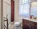 Bathroom with a shower, lots of natural light, toilet, and sink/vanity at 1003 Wichman St, Walterboro, SC 29488