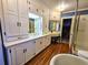 Spacious bathroom with white cabinetry, modern sink and separate wash room with shower at 1003 Wichman St, Walterboro, SC 29488