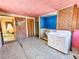 Bathroom with a sink in the foreground and a bathtub in the background, needs renovation at 1003 Wichman St, Walterboro, SC 29488
