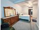 Comfortable bedroom features neutral walls, a spacious dresser and a ceiling fan to keep the room cool at 1003 Wichman St, Walterboro, SC 29488