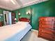 Bedroom features a four poster bed, green walls, and classic wood furnishings at 1003 Wichman St, Walterboro, SC 29488