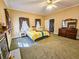 This bedroom features natural light, carpet, and a lovely fireplace, creating a welcoming space at 1003 Wichman St, Walterboro, SC 29488
