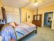 Bedroom with vintage elements, featuring a four-poster bed and carpeted floors at 1003 Wichman St, Walterboro, SC 29488