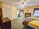 A bedroom featuring a fireplace, large closet, and neutral color palette at 1003 Wichman St, Walterboro, SC 29488