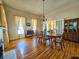 Dining room with hardwood floors, fireplace, chandelier and views to other rooms at 1003 Wichman St, Walterboro, SC 29488