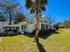 Charming two-story home with lush lawn and landscaping at 1003 Wichman St, Walterboro, SC 29488