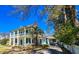 Beautiful two-story home with a palm tree, white pillars, and a connected garage at 1003 Wichman St, Walterboro, SC 29488