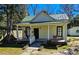 Charming home with a cozy front porch, swing, and well-maintained yard at 1003 Wichman St, Walterboro, SC 29488