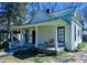 Charming house with a swing on the porch, perfect for relaxing outdoors at 1003 Wichman St, Walterboro, SC 29488