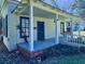 Charming home featuring a welcoming covered front porch and an inviting, classic design and beautiful landscaping at 1003 Wichman St, Walterboro, SC 29488