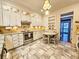 Well lit kitchen with modern appliances, granite counters and a breakfast table at 1003 Wichman St, Walterboro, SC 29488