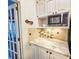 Kitchen with granite counters, stainless appliances and adjacent to a door to the outside at 1003 Wichman St, Walterboro, SC 29488