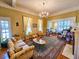 Sophisticated living room boasts hardwood floors, patterned wallpaper, and a fireplace at 1003 Wichman St, Walterboro, SC 29488