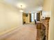 Open living room with neutral carpet, classic lighting, and a brick fireplace at 1003 Wichman St, Walterboro, SC 29488