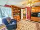Cozy living room with built-in bookshelves and a comfortable armchair, perfect for relaxing at 1003 Wichman St, Walterboro, SC 29488