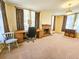 Spacious Living room with neutral carpet, brick fireplace and large windows at 1003 Wichman St, Walterboro, SC 29488