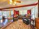 Bright living room with hardwood floors, fireplace, and large windows, creating a cozy and inviting atmosphere at 1003 Wichman St, Walterboro, SC 29488