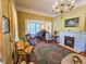 Classic living room with fireplace, piano, and vintage-style furniture at 1003 Wichman St, Walterboro, SC 29488