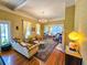 Elegant living room features hardwood floors, patterned wallpaper, and ample seating at 1003 Wichman St, Walterboro, SC 29488