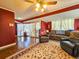 Bright living room with hardwood floors, fireplace, and large windows, creating a cozy and inviting atmosphere at 1003 Wichman St, Walterboro, SC 29488
