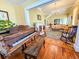 Open-concept living room with hardwood floors, a piano room, and a fireplace, creating an inviting space at 1003 Wichman St, Walterboro, SC 29488