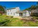 This view of the backyard showcases both the lawn and the concrete patio area at 102 Challis Ct, Goose Creek, SC 29445