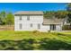 View of the home's backyard showing the lawn, fence, siding, and sliding glass door at 102 Challis Ct, Goose Creek, SC 29445