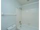 A full bathroom includes a tiled shower and bathtub, as well as a standard white toilet at 102 Challis Ct, Goose Creek, SC 29445