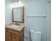 Bathroom with a wood vanity, neutral countertop, a single sink, and a mirror with modern lighting at 102 Challis Ct, Goose Creek, SC 29445