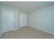 Bright bedroom features neutral carpet, white walls, and double closets at 102 Challis Ct, Goose Creek, SC 29445