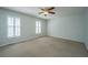 Spacious bedroom with carpet, plantation shutters, and a ceiling fan at 102 Challis Ct, Goose Creek, SC 29445