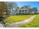 View of the home's front exterior, showcasing a traditional style with tidy landscaping at 102 Challis Ct, Goose Creek, SC 29445
