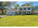 Well-maintained front lawn with a view of the home's facade and attached garage at 102 Challis Ct, Goose Creek, SC 29445