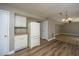 Bright kitchen with wood flooring, white cabinets and appliances, and an open layout at 102 Challis Ct, Goose Creek, SC 29445