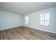 Spacious living room featuring luxury vinyl plank flooring and plantation shutters at 102 Challis Ct, Goose Creek, SC 29445